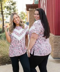 Boutique Simplified Chasing Arrows Short Sleeve Top