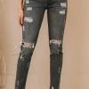 Trendsi Kancan Maggie Mid-Rise Distressed Skinny Jeans Apparel
