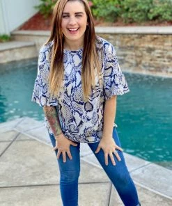 Boutique Simplified 1X Serpentine Goddess Bell Sleeve Top