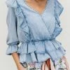 Trendsi Apparel First Day Denim Ruffle Peplum Top